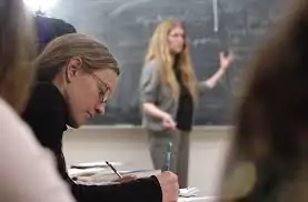 girl taking notes