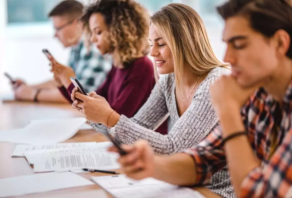 Students with cell phone in a classroom